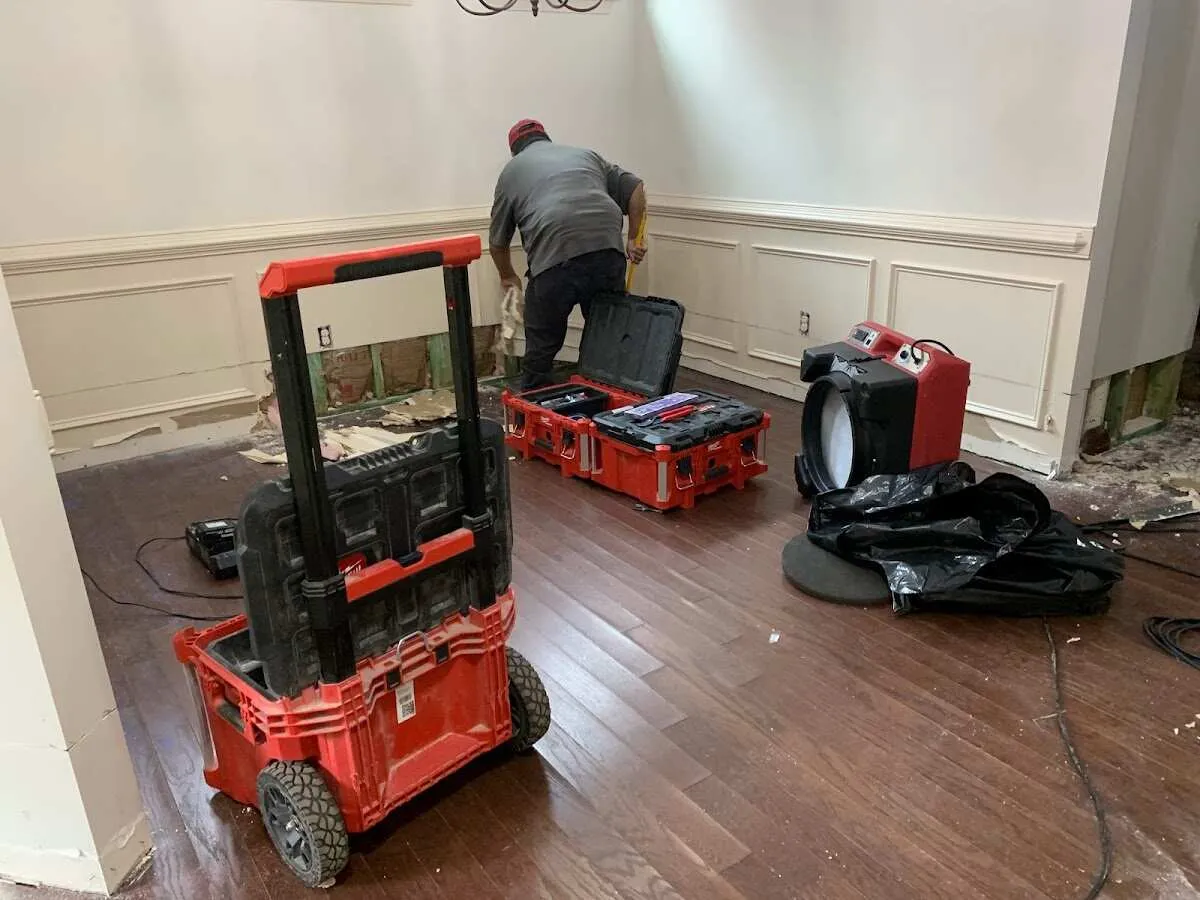 Technician setting up drying equipment for water damage in Springboro